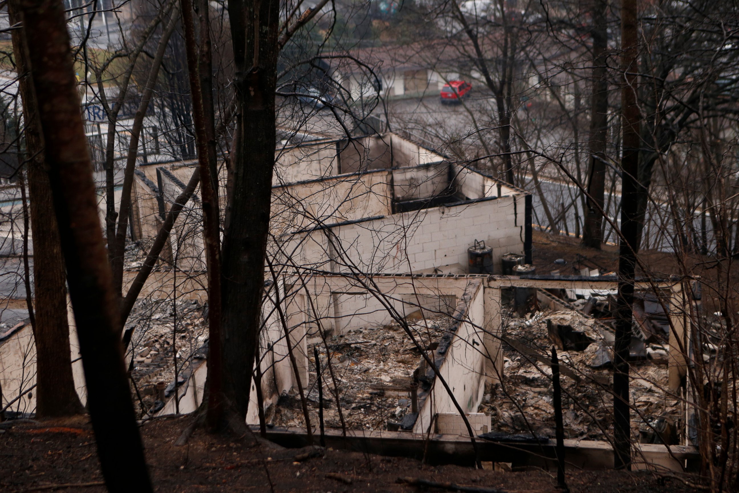 PHOTO: The remains of a business are pictured in the wake of a wildfire, Nov. 30, 2016, in Gatlinburg, Tennessee. 