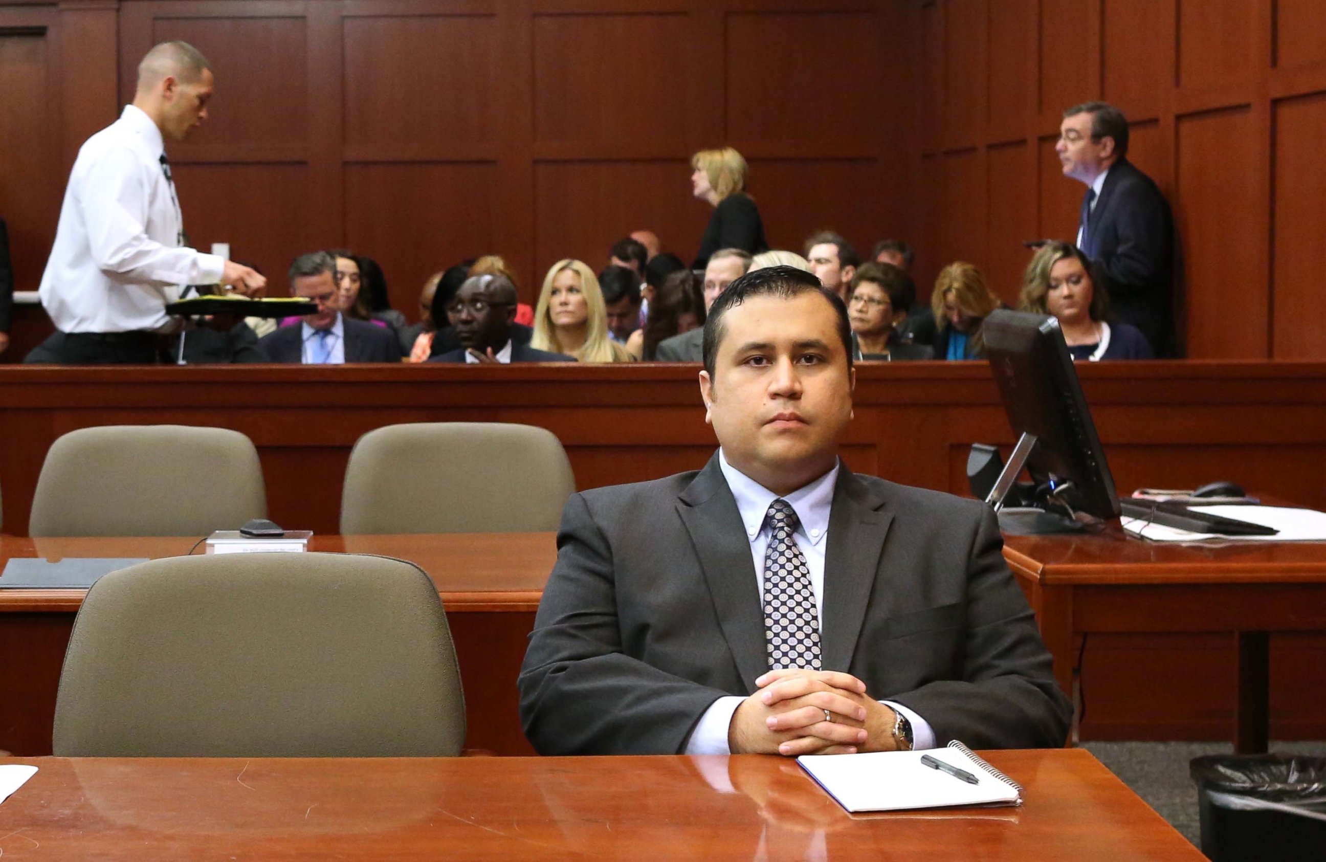 PHOTO: George Zimmerman waits for his defense counsel to arrive in Seminole circuit court, on the 11th day of his murder trial in the 2012 death of Trayvon Martin, June 24, 2013 in Sanford, Fla.