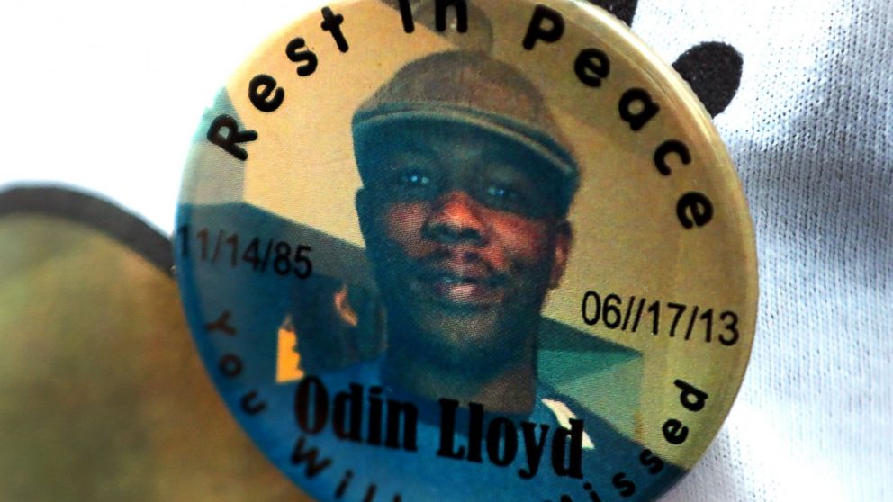 PHOTO: A funeral service was held for Odin Lloyd at the Holy Spirit Church in Mattapan. Lloyd was allegedly shot to death by former Patriots player Aaron Hernandez. A funeral-goer wears a button with his portrait.