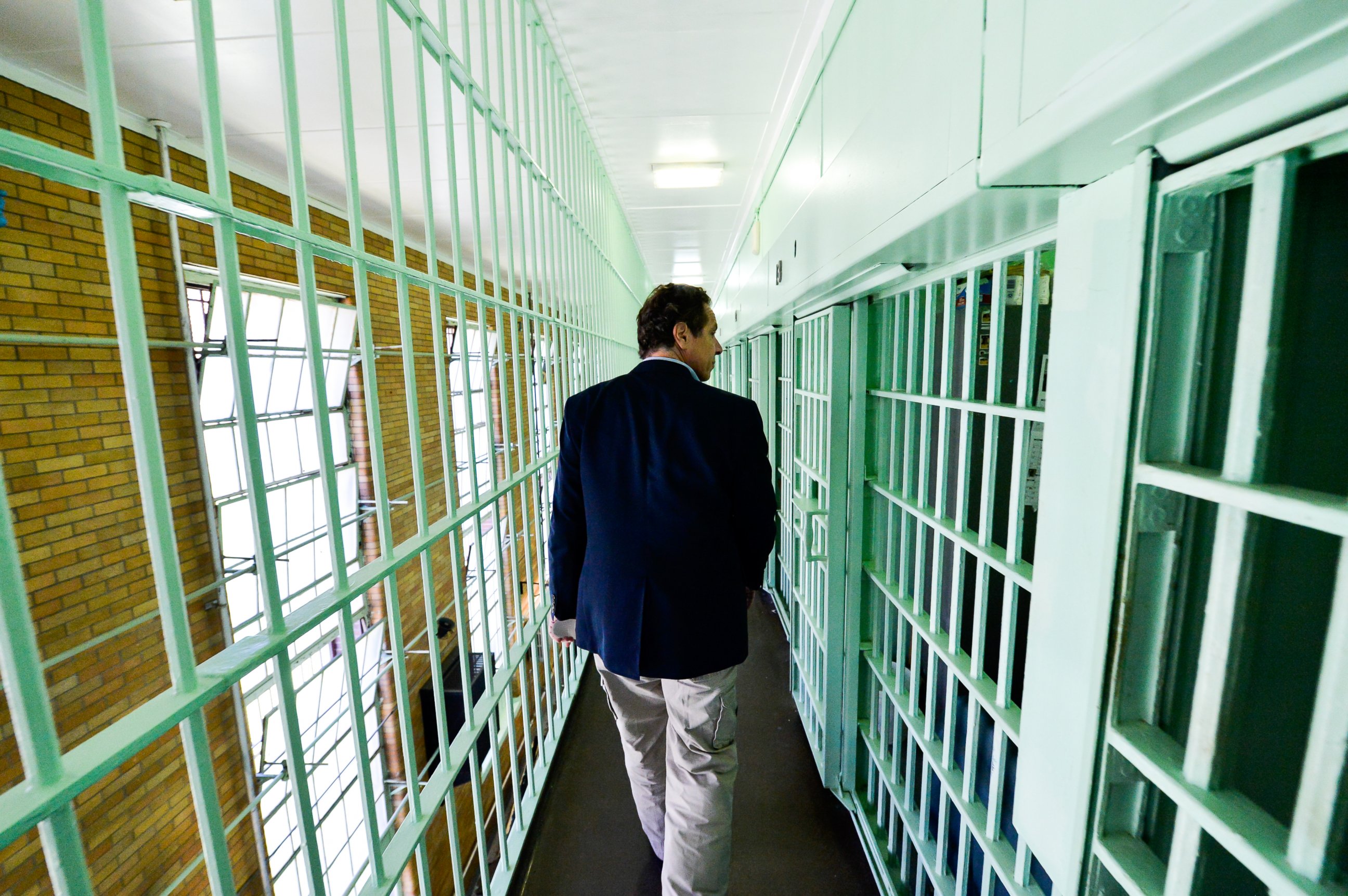 PHOTO: In this handout from the New York State Governor's Office, New York Gov. Andrew Cuomo walks past jail cells where two convicted murderers fled from the Clinton Correctional Facility June 6, 2014 in Dannemora, New York.  