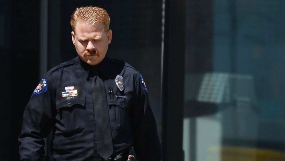 PHOTO: Aurora police officer Aaron Blue leaves court after testifying in James Holmes' trial at the Arapahoe County Justice Center in Centennial, Colo.,April 30, 2015.