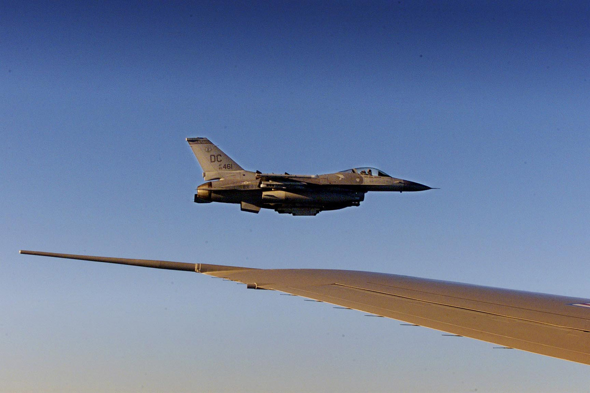 PHOTO: An F-16 fighter flies just off the wing of Air Force One on a flight back to Washington, Sept. 11, 2001. 
