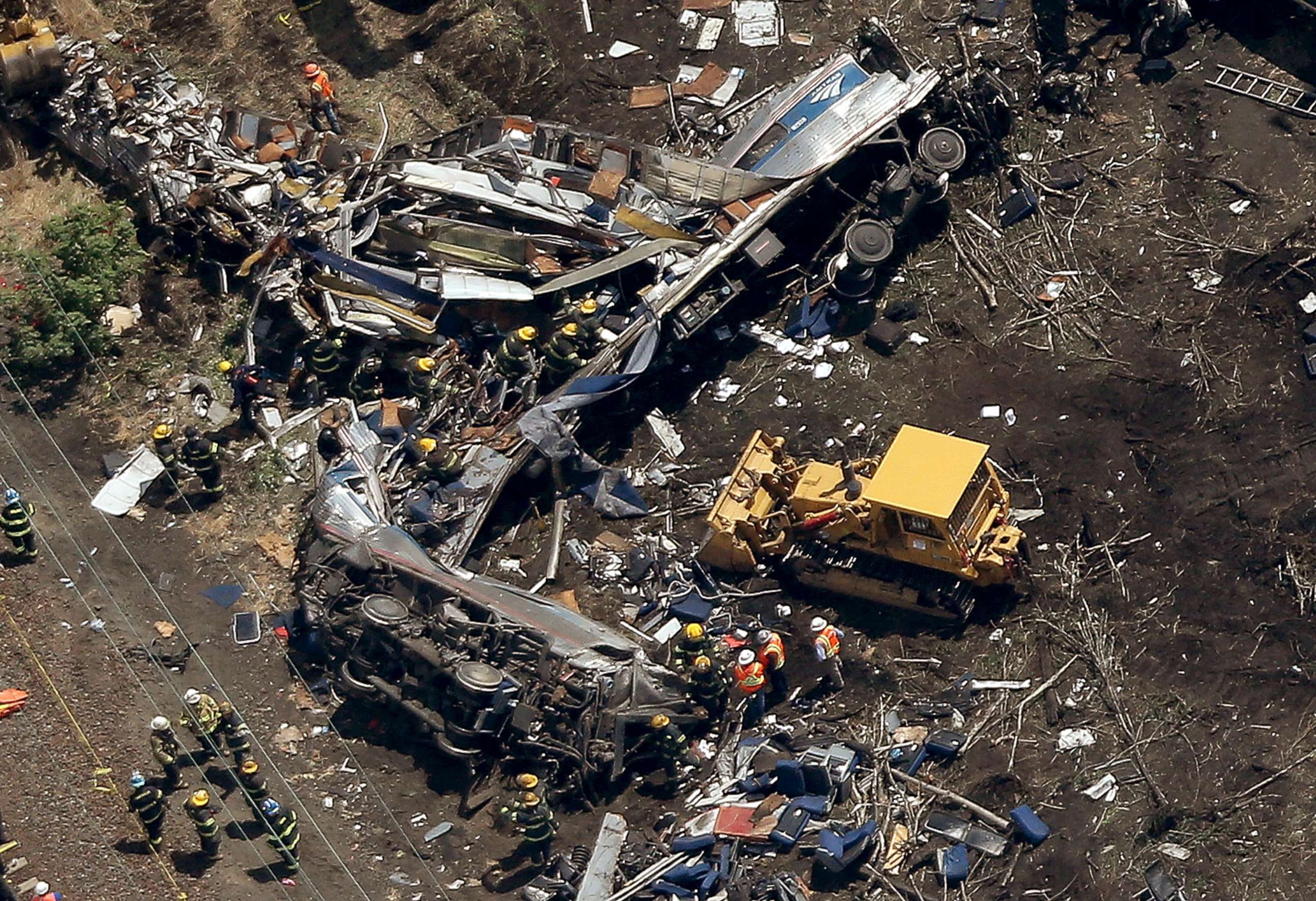PHOTO: Investigators work near the wreckage of a derailed Amtrak passenger train in this May 13, 2015 file photo in north Philadelphia.
