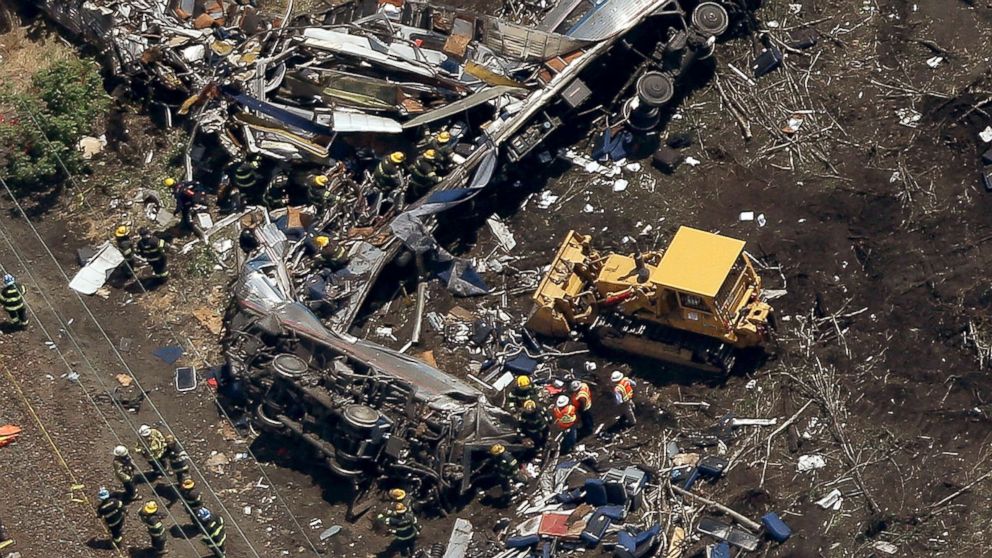 PHOTO: Investigators work near the wreckage of a derailed Amtrak passenger train in this May 13, 2015 file photo in north Philadelphia.