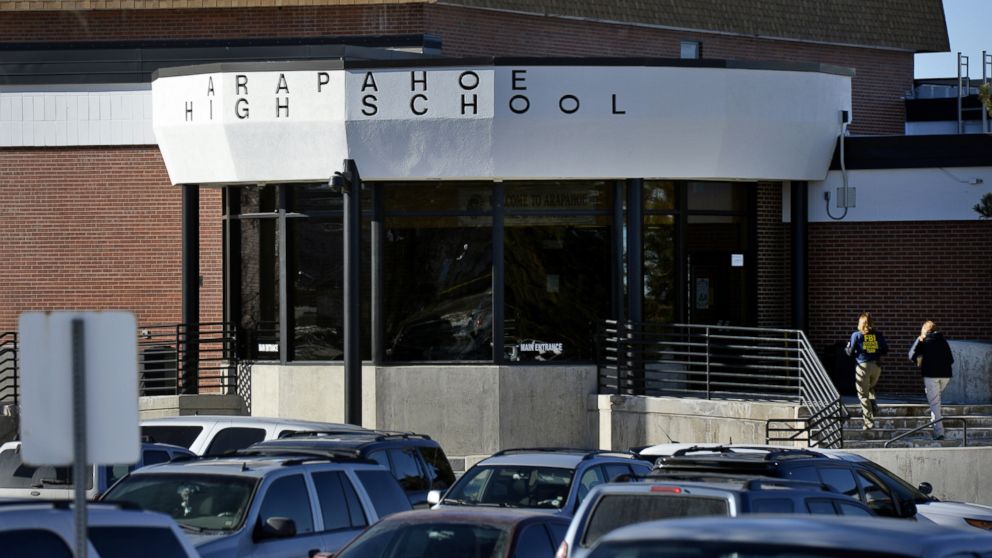 Investigators enter Arapahoe High School in Centennial, Colo., Dec. 14, 2013, where Karl Pierson shot a fellow student before turning his weapon on himself.