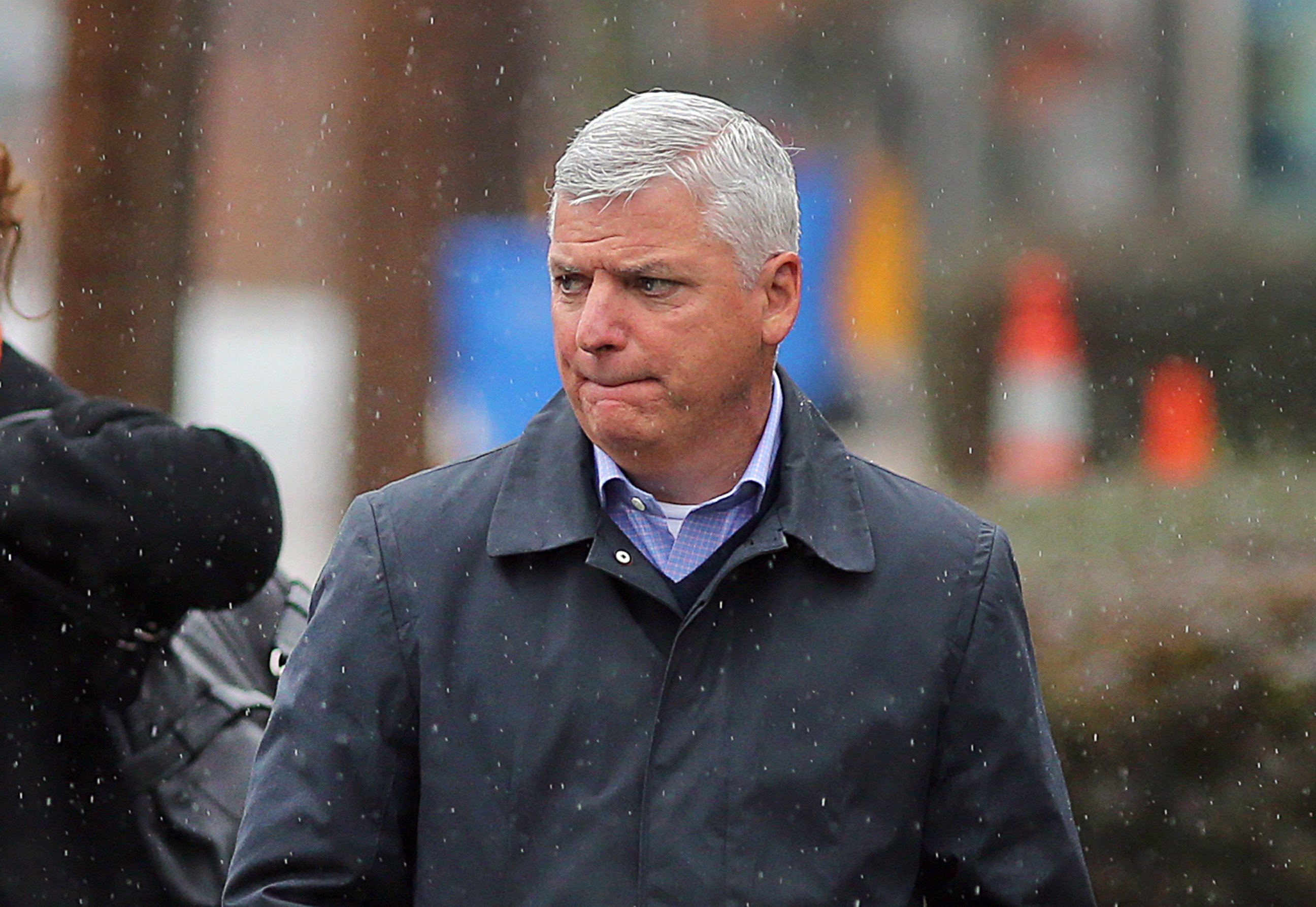 PHOTO: District Attorney Dan Conley leaves the Caggiano Funeral Home in the rain on Nov. 28, 2015, in Winthrop, Mass.