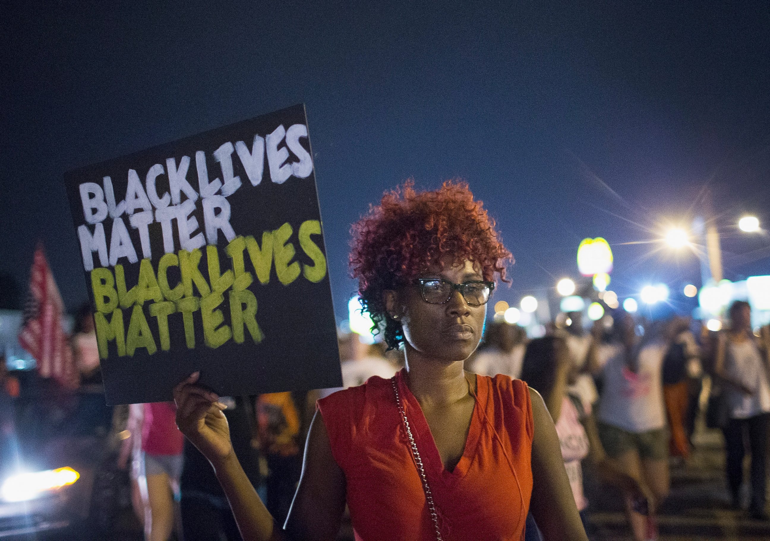PHOTO: People march to mark the first anniversary of the death of Michael Brown on August 8, 2015 in Ferguson, Missouri. 