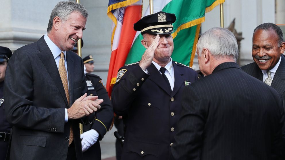 PHOTO: New York City Police Commissioner Bill Bratton is saluted by incoming Police Commissioner James "Jimmy" O'Neill as he walks through 1 Police Plaza in downtown Manhattan during a ceremonial send-off on Sept. 16, 2016 in New York City.