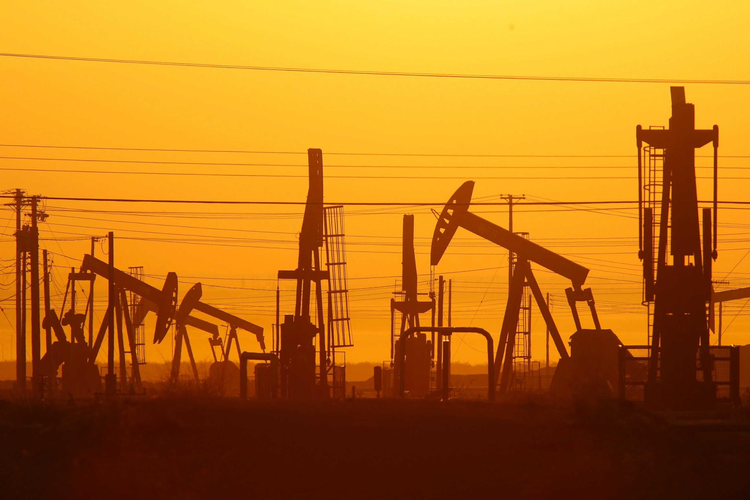 PHOTO: Pump jacks are seen at dawn in an oil field over the Monterey Shale formation where gas and oil extraction using hydraulic fracturing, or fracking, is on the verge of a boom on March 24, 2014 near Lost Hills, Calif.