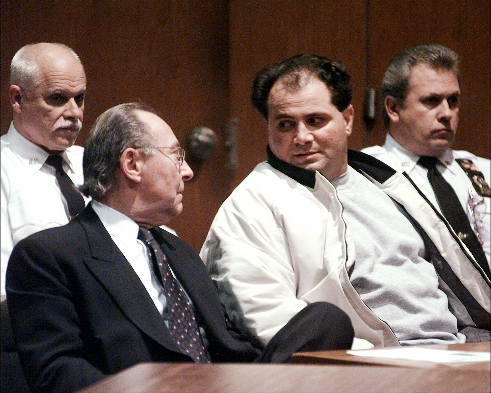 PHOTO: Carmine Agnello confers with his lawyer at bail hearing in Queens Supreme Court. in 2000.