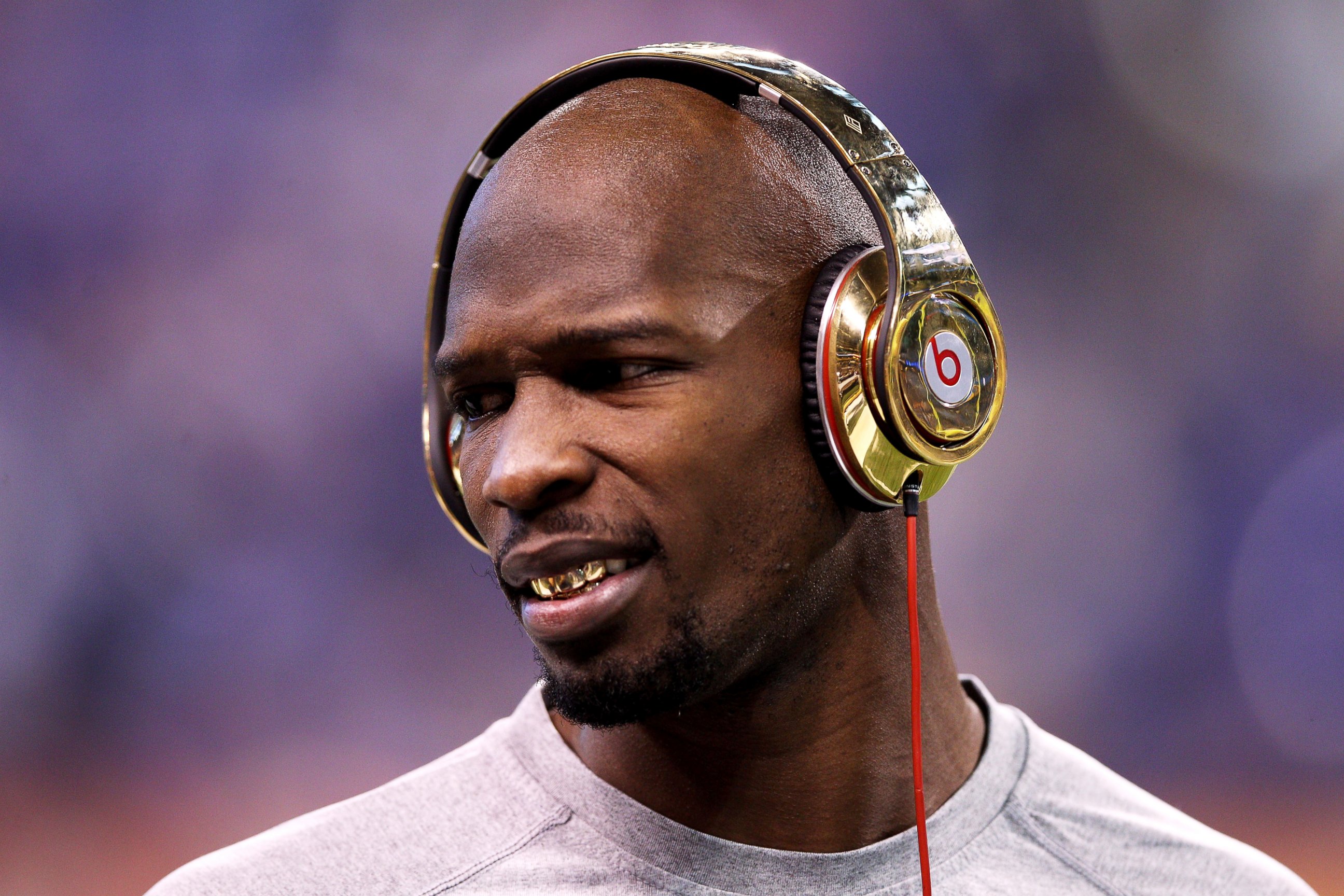 PHOTO: Chad 'Ochocinco' Johnson of the New England Patriots waits on the field before Super Bowl XLVI at Lucas Oil Stadium on Feb. 5, 2012 in Indianapolis, Ind.