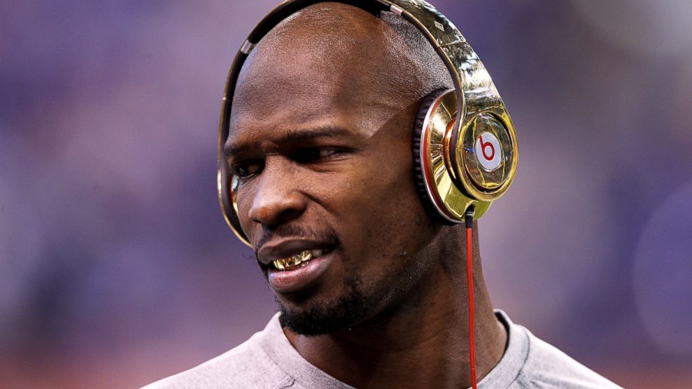PHOTO: Chad 'Ochocinco' Johnson of the New England Patriots waits on the field before Super Bowl XLVI at Lucas Oil Stadium on Feb. 5, 2012 in Indianapolis, Ind.