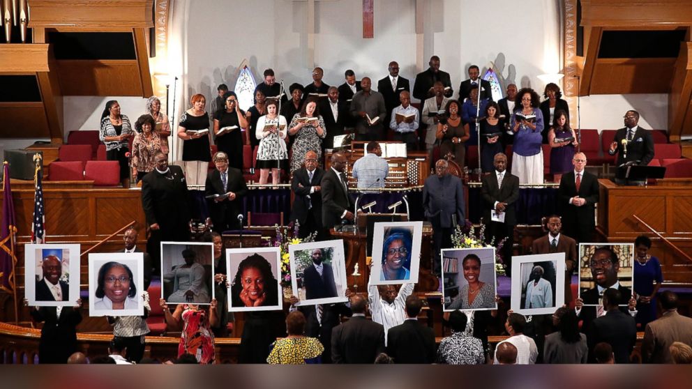Photographs of the nine victims killed at the Emanuel African Methodist Episcopal Churuch in Charleston, S.C. are held up by congregants during a prayer vigil at the the Metropolitan AME Church June 19, 2015 in Washington, DC.