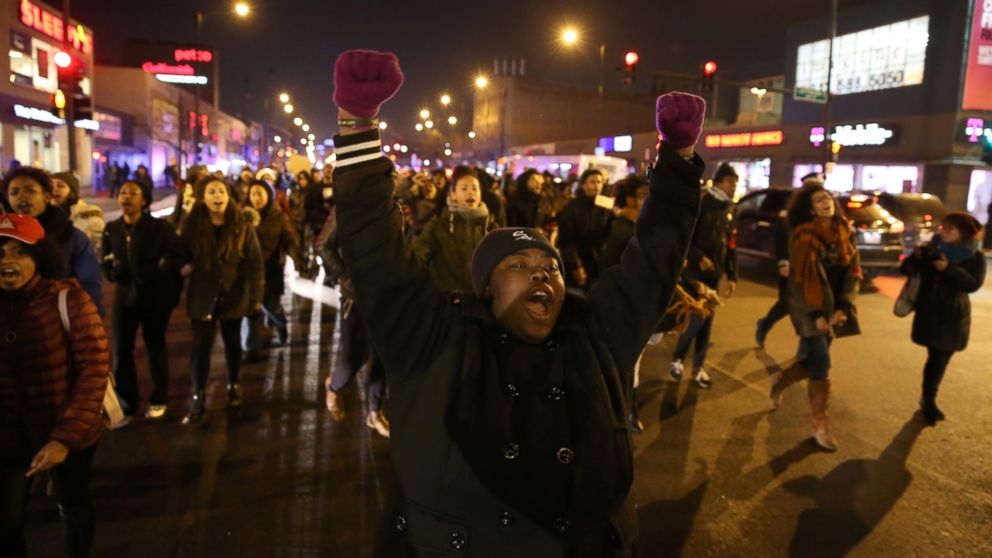 Demonstrators react near Halsted Street and Roosevelt Road in Chicago after the release of the 2014 video of Laquan McDonald being shot by Chicago Police officer Jason Van Dyke, Nov. 24, 2015.