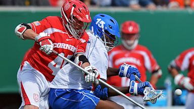 PHOTO: Cornell University Big Red and the Duke University Blue Devils lacrosse teams battle for a loose ball.