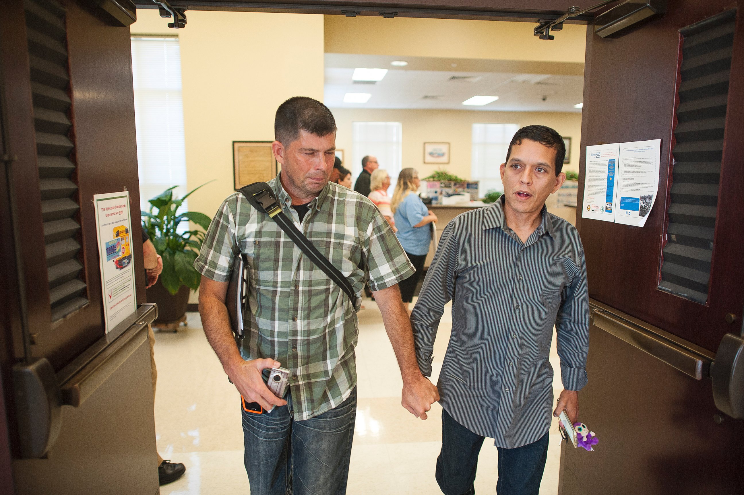 PHOTO: Robbie Blankenship and his partner Jesse Cruz leave the Rowan County Clerks Office after being denied a marriage license on Sept. 2, 2015 in Morehead, Ky.