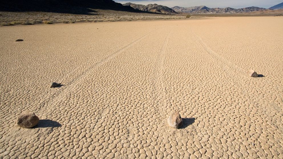 PHOTO: A recent study by PLOS suggests that the movement of these stones is caused by the melting ice sheet in Racetrack Playa, Calif.