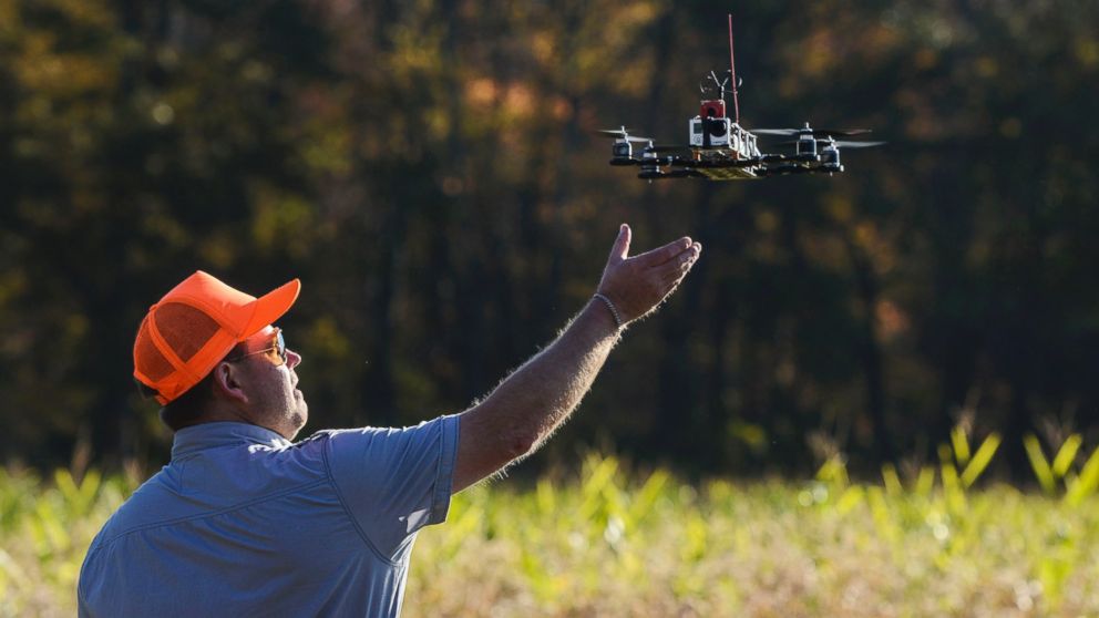 PHOTO: A drone lands after taking footage at Erwin Wilder Wildlife Management Area at  on October 21, 2013 in Norton, Mass. Drones are used in the area to help seek out illegal hunting activity.