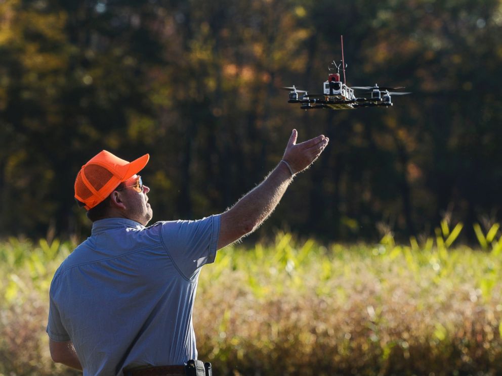 PHOTO: A drone lands after taking footage at Erwin Wilder Wildlife Management Area at on October 21, 2013 in Norton, Mass. Drones are used in the area to help seek out illegal hunting activity.