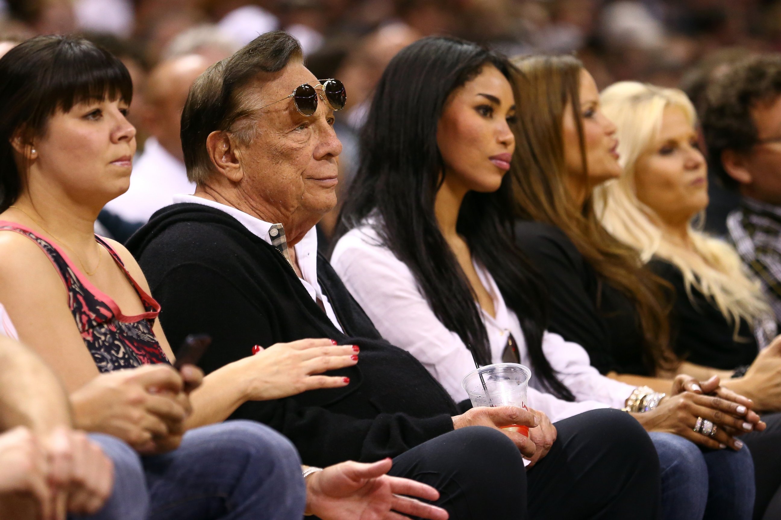 PHOTO: Team owner Donald Sterling of the Los Angeles Clippers and V. Stiviano watch the San Antonio Spurs play  on May 19, 2013 in San Antonio, Texas.  