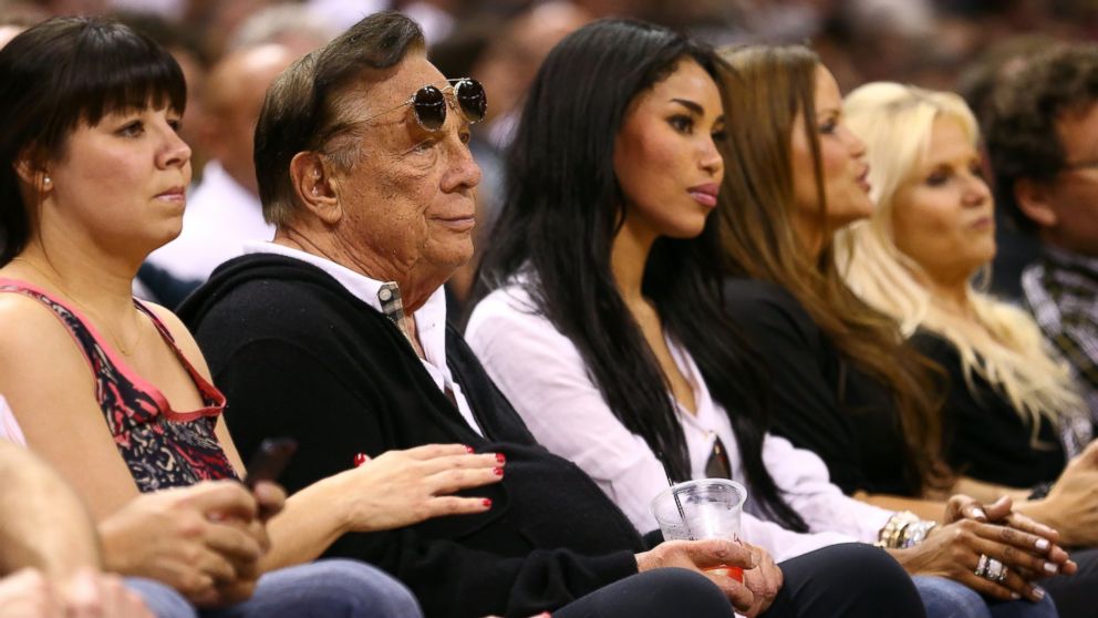 PHOTO: Team owner Donald Sterling of the Los Angeles Clippers and V. Stiviano watch the San Antonio Spurs play  on May 19, 2013 in San Antonio, Texas.  