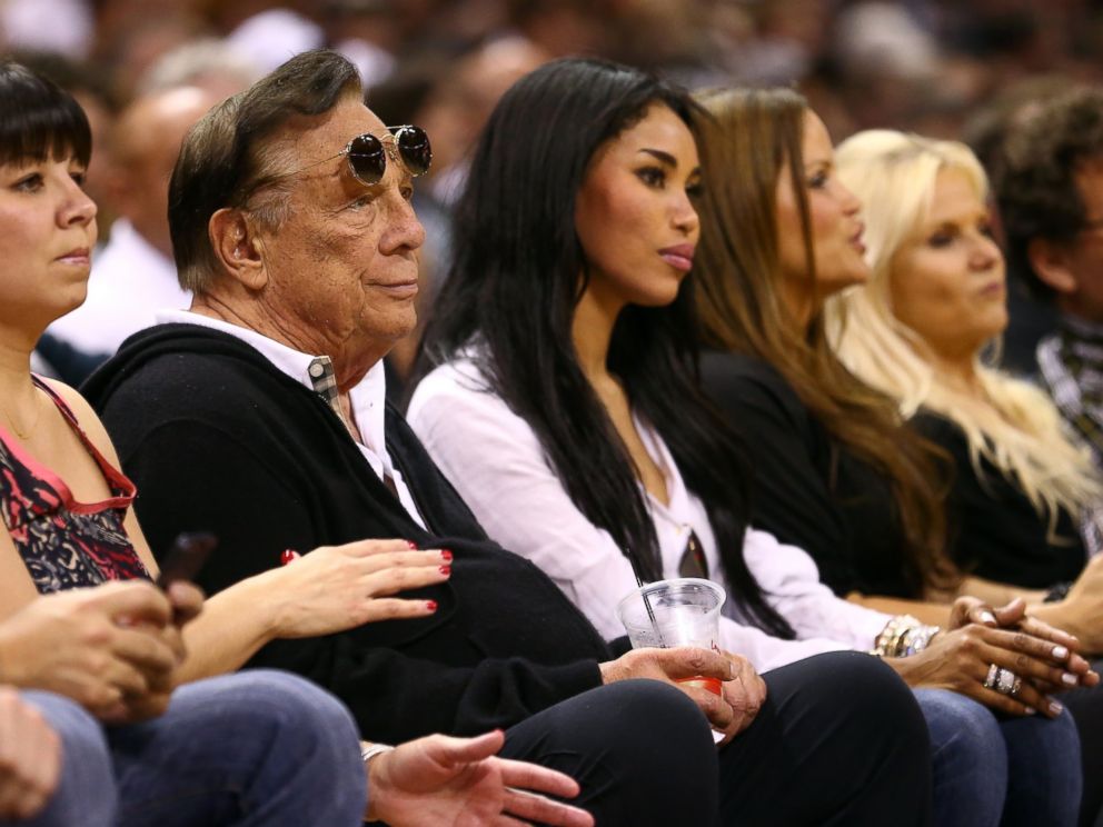 PHOTO: Team owner Donald Sterling of the Los Angeles Clippers and V. Stiviano watch the San Antonio Spurs play on May 19, 2013 in San Antonio, Texas.