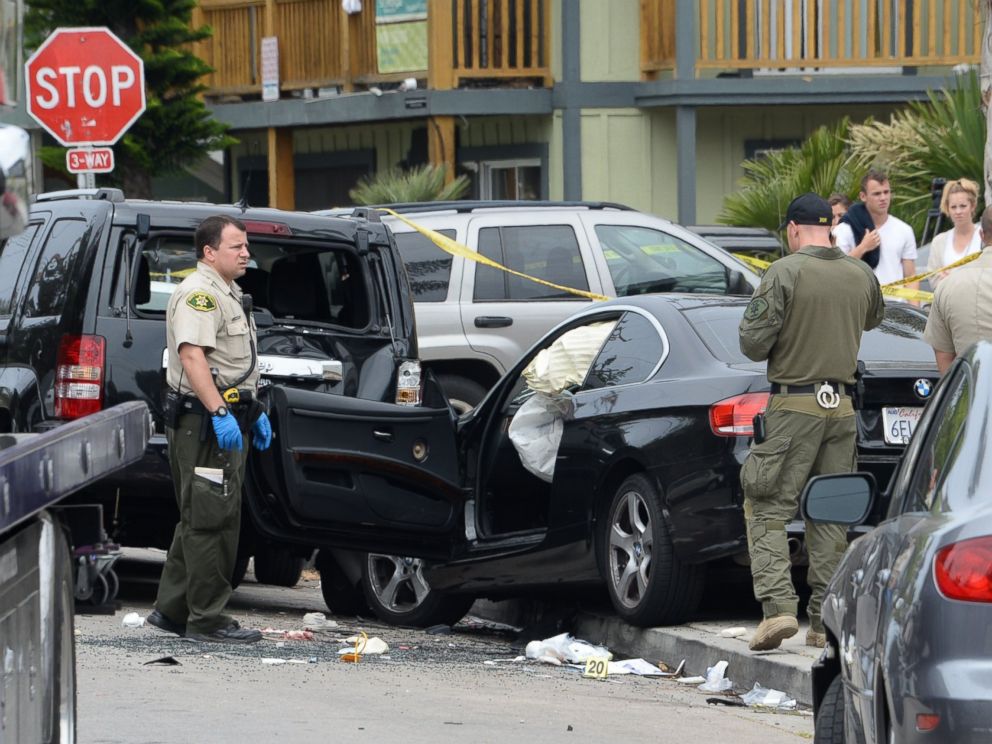 PHOTO: Investigators examine the car driven by Elliot Rodgers on May 24, 2014, the day after his killing spree in Isla Vista, Calif.