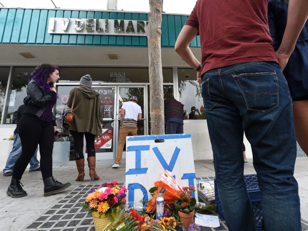 PHOTO: People stop at a makeshift memorial in front of Isla Vista Deli Mart, one of the locations of a killing spree by Elliot Rodger in Isla Vista, Calif. on May 24, 2014.