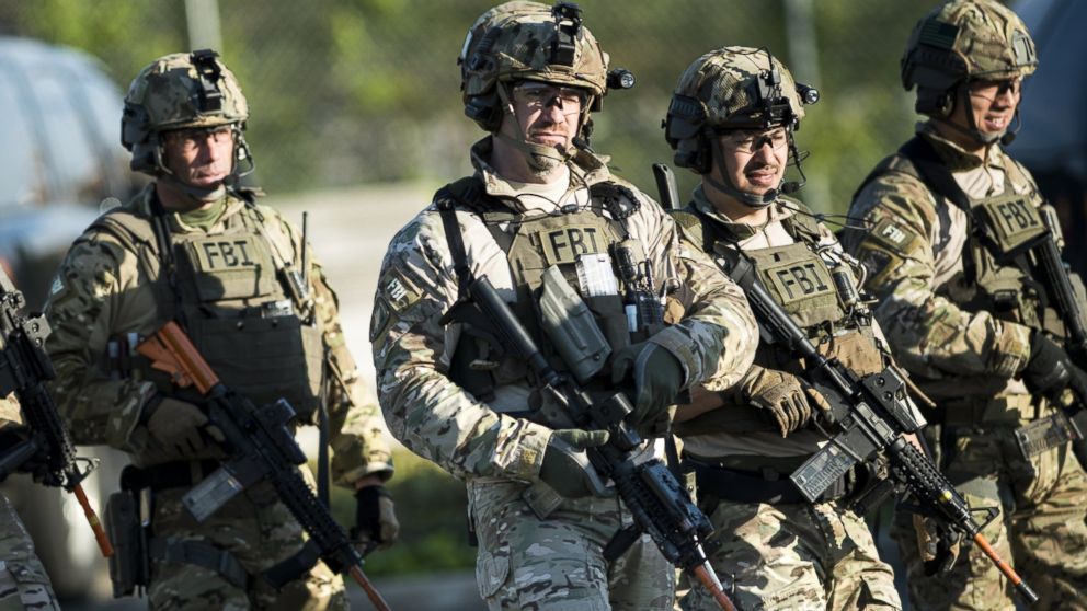 Members of a Federal Bureau of Investigation SWAT team are seen as they walk to enter a mall during an FBI field training exercise at the Landmark Mall on May 2, 2014 in Alexandria, Virginia.