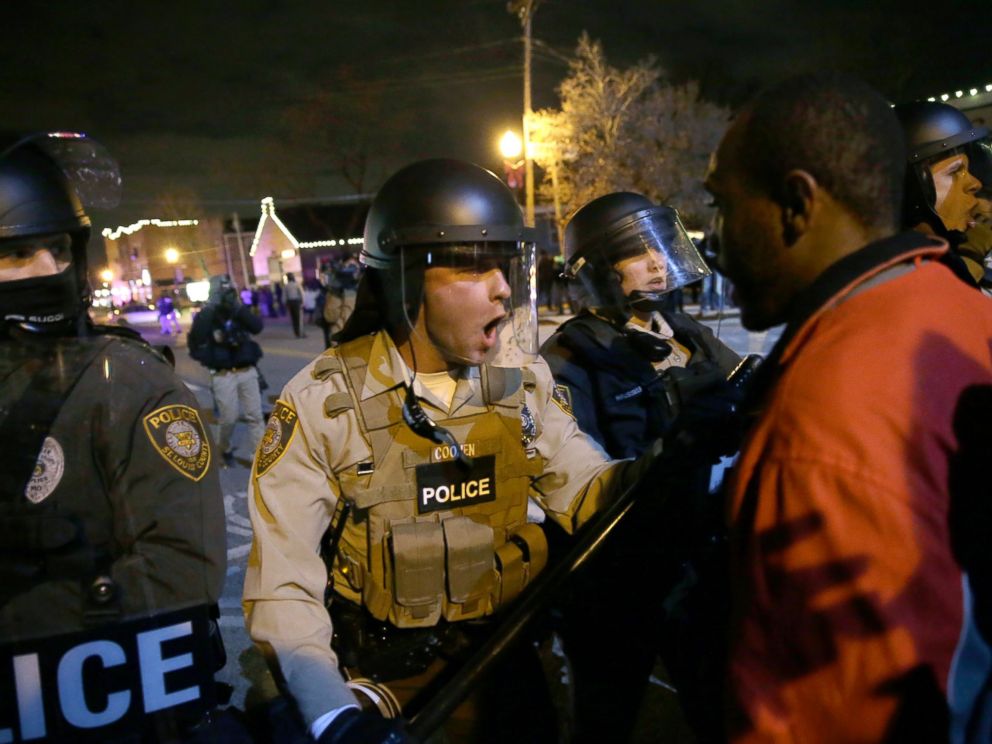 PHOTO: Police officers confront protesters after the announcement of the grand jury decision not to indict police officer Darren Wilson in the fatal shooting of Michael Brown on Nov. 24, 2014, in Ferguson, Mo.
