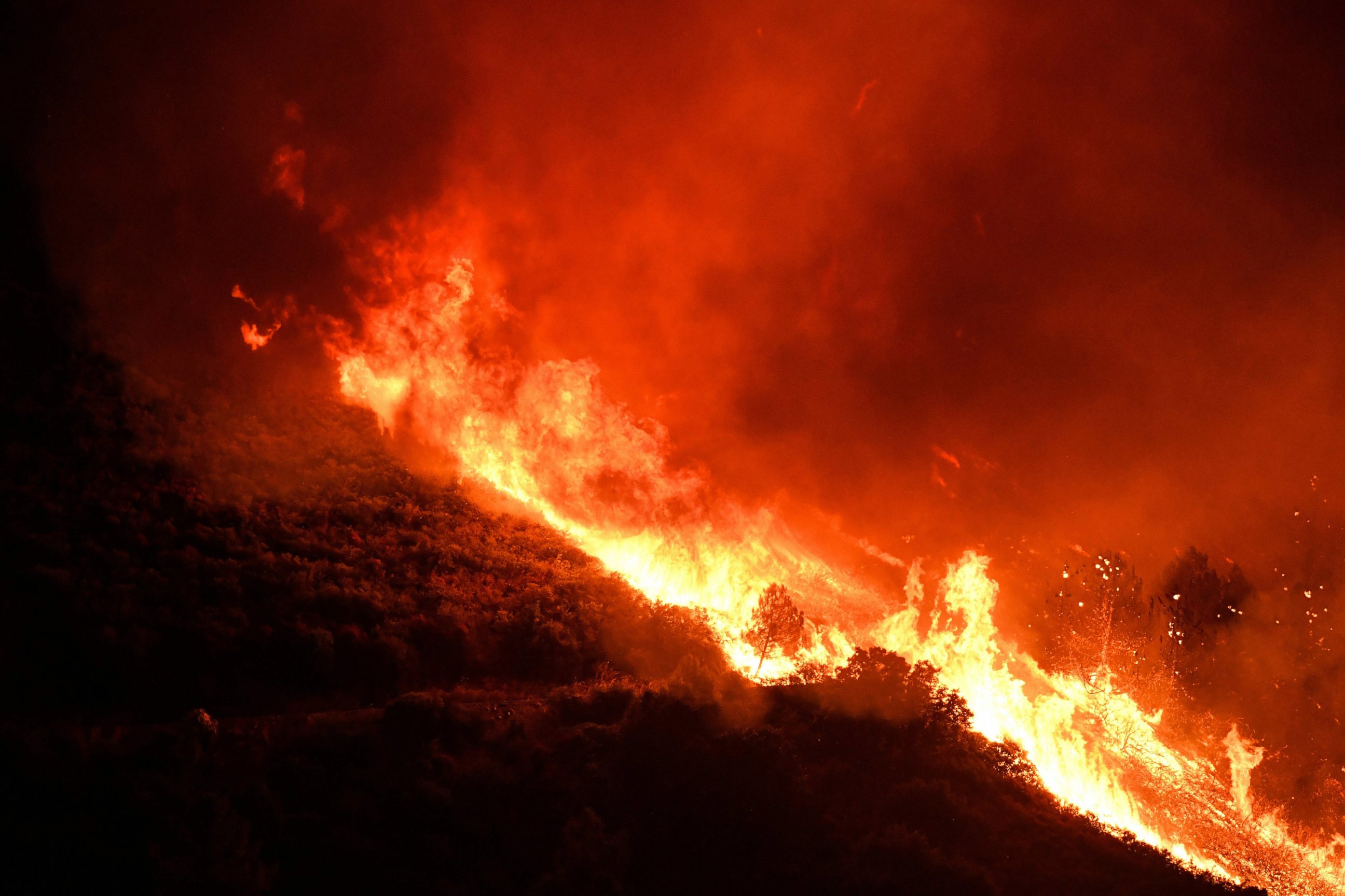 PHOTO: Flames climb toward Loma Prieta peak in California's Santa Cruz Mountains, Sept. 26, 2016. 