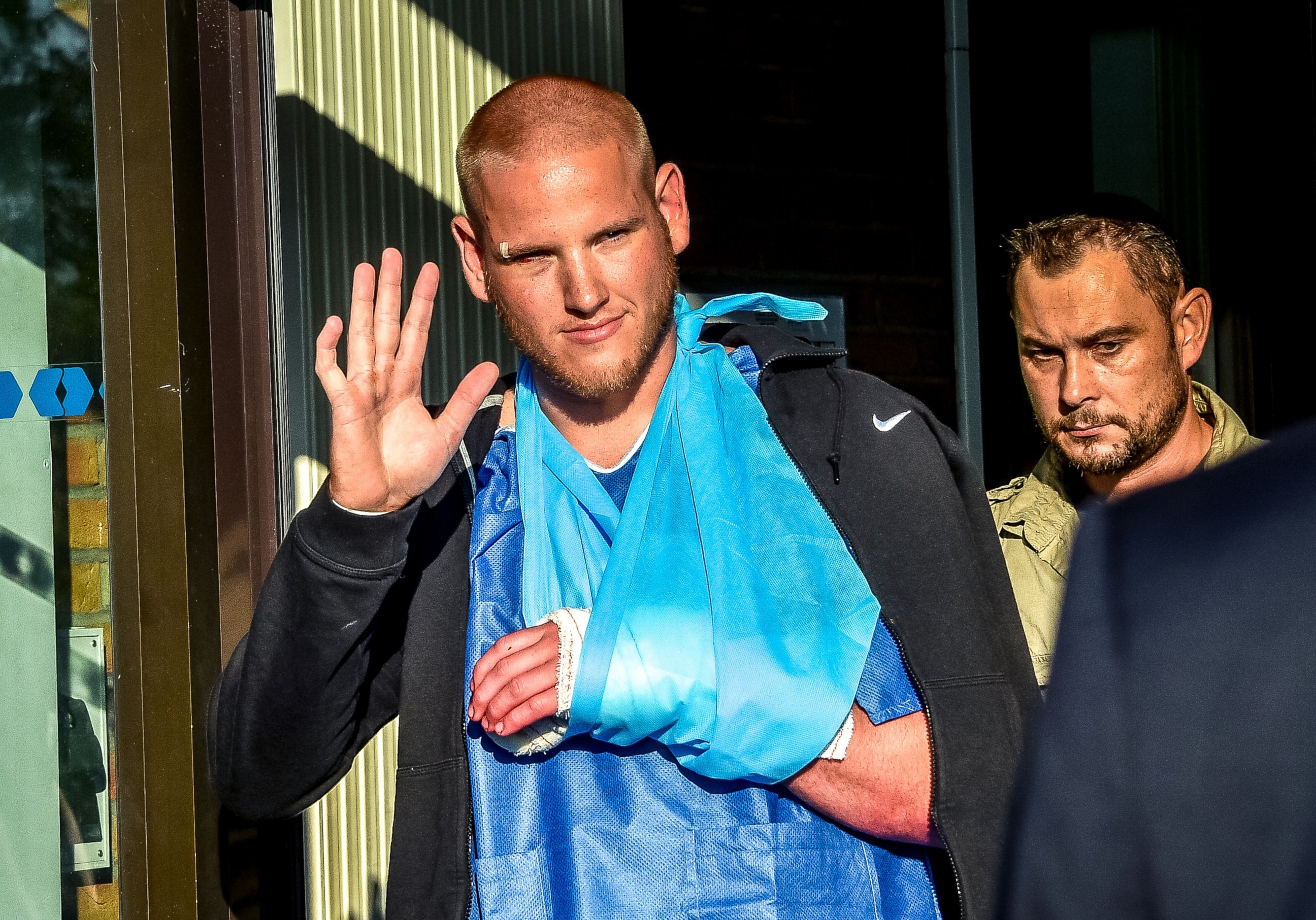 PHOTO: Off-duty US Air Force Spencer Stone (L), one of the men to overpower the gunman who opened fire with an assault rifle on a high-speed train, gestures as he leaves the hospital, Aug. 22, 2015, in Lesquin, France.