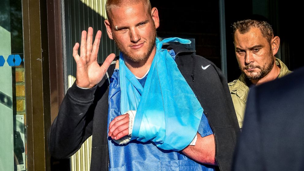 PHOTO: Off-duty US Air Force Spencer Stone (L), one of the men to overpower the gunman who opened fire with an assault rifle on a high-speed train, gestures as he leaves the hospital, Aug. 22, 2015, in Lesquin, France.