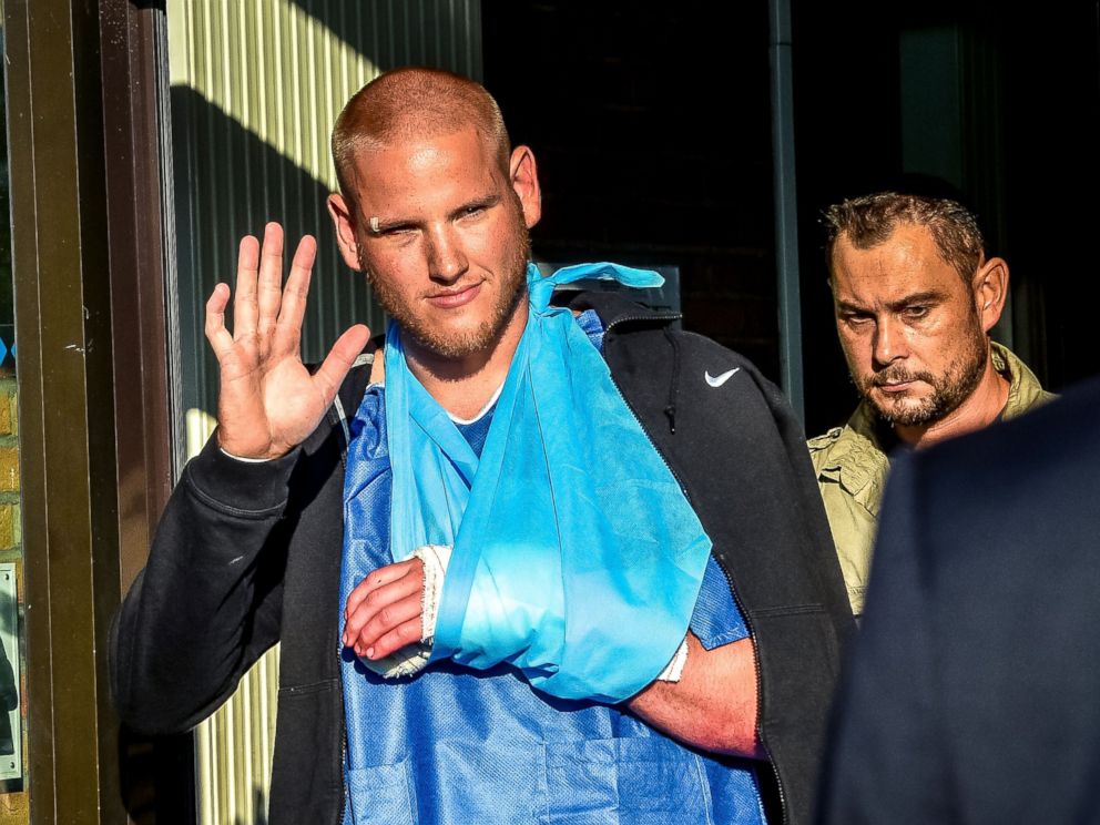 PHOTO: Off-duty US Air Force Spencer Stone (L), one of the men to overpower the gunman who opened fire with an assault rifle on a high-speed train, gestures as he leaves the hospital, Aug. 22, 2015, in Lesquin, France.