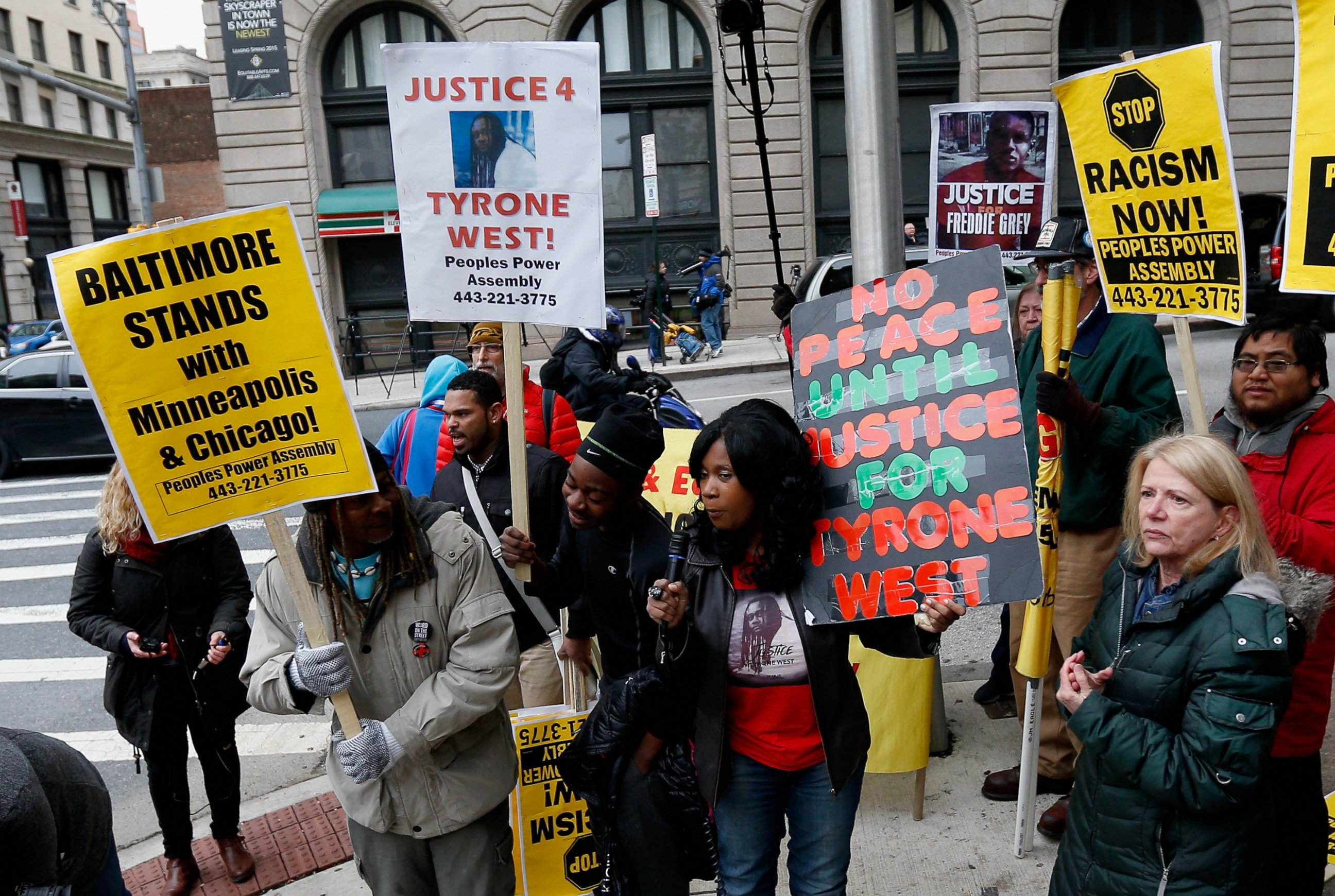 PHOTO:Protestors hold up signs in front of the courthouse where jury selection began in the trial of William Porter, one of six Baltimore city police officers charged in connection to the death of Freddie Gray, Nov. 30, 2015, in Baltimore. 
