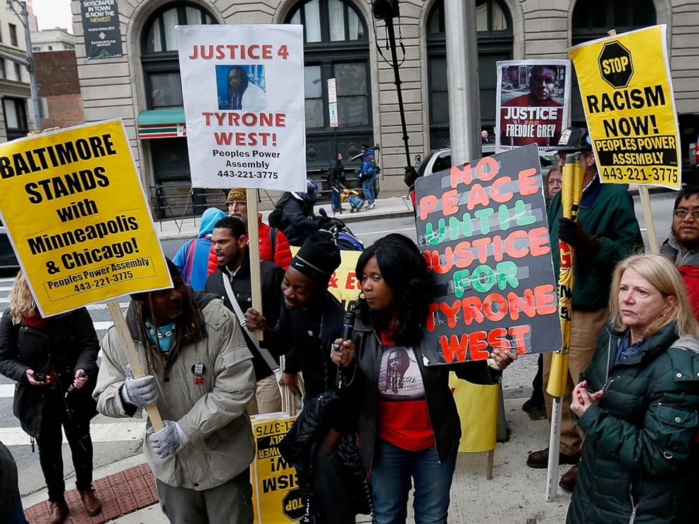 PHOTO:Protestors hold up signs in front of the courthouse where jury selection began in the trial of William Porter, one of six Baltimore city police officers charged in connection to the death of Freddie Gray, Nov. 30, 2015, in Baltimore.