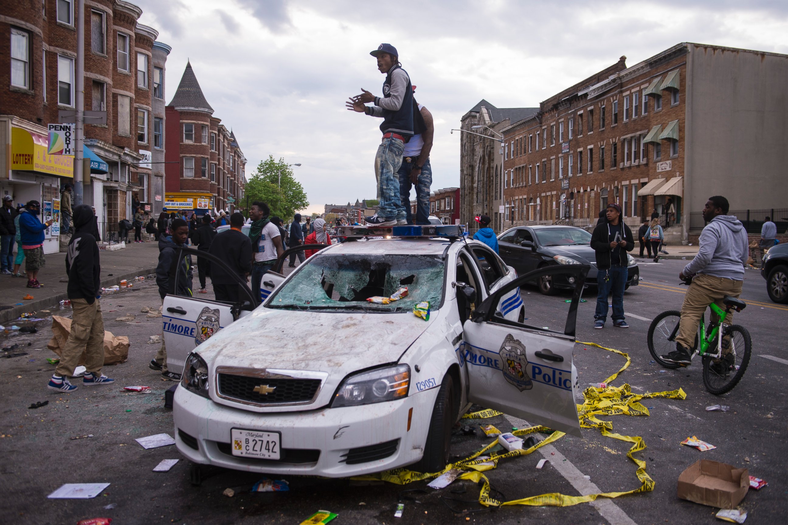 PHOTO: People stand on a police car during a protest for Freddie Gray in Baltimore, April 27, 2015.