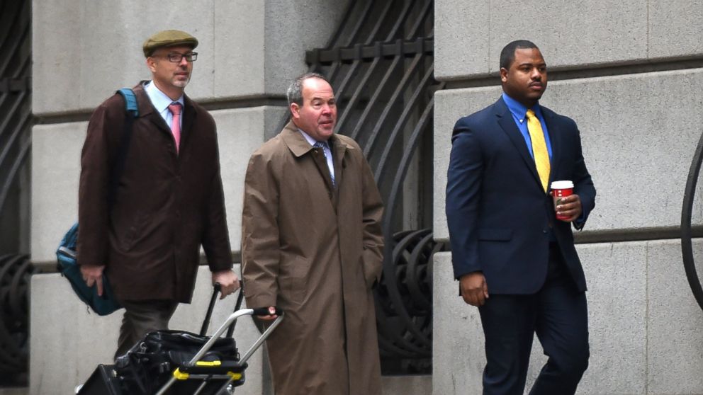 William Porter, far right, along with his lawyer Joseph Murtha, center, enter the Baltimore City courthouse to begin the trial in the the death of Freddie Gray on Nov. 30, 2015 in Baltimore.