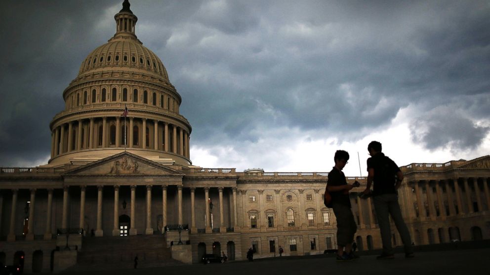 Storm clouds hang over the U.S. Capitol in Washington in this June 13, 2013 photo.