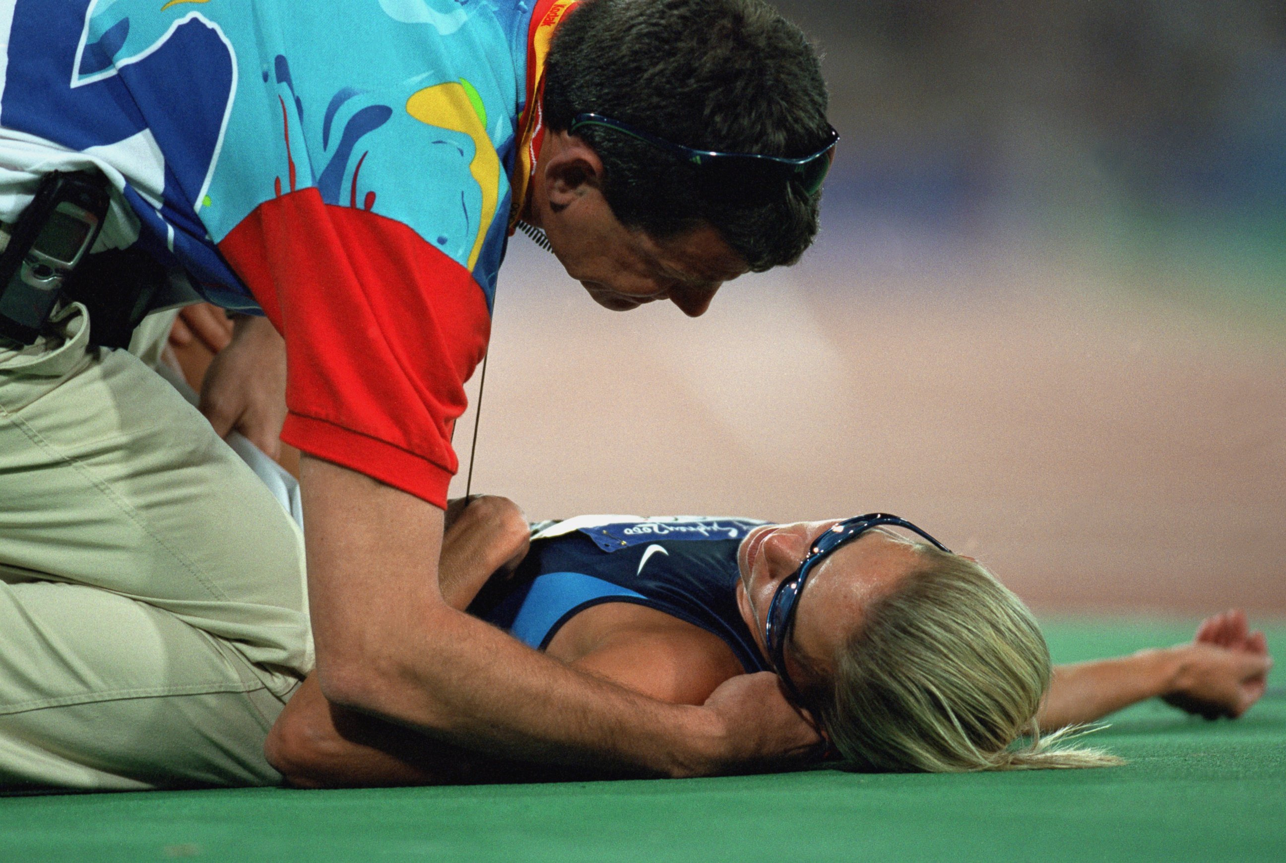 PHOTO: Suzy Favor-Hamilton lays on the track from over exertion after the womens' 1500 meter race during the  Olympics at the Olympic Stadium in Sydney, on Sept. 30, 2000. 