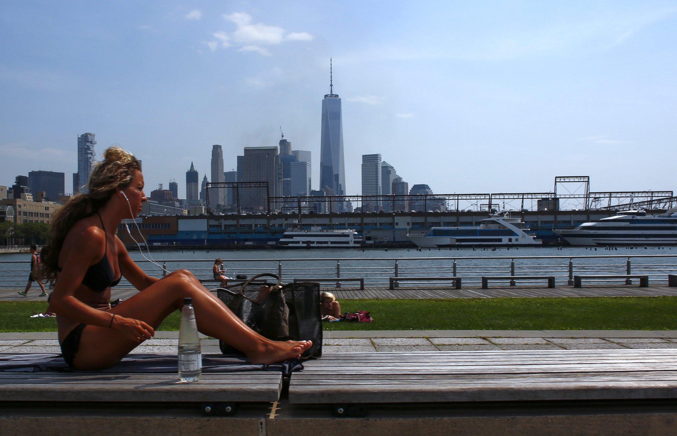 PHOTO: A woman sunbathes as the temperature in New York feels like 100 degrees, July 25, 2016. 