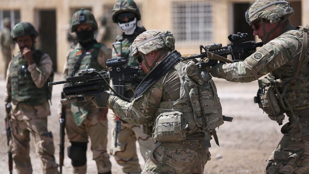 U.S. Army trainers instruct Iraqi Army recruits at a military base on April 12, 2015 in Taji, Iraq.