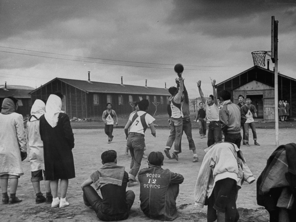 PHOTO: Young men play basketball at a Japanese internment camp in Tule Lake, Calif. in 1944.