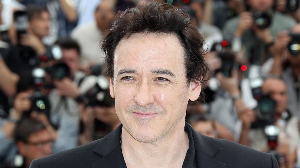 John Cusack poses during the photocall of "The Paperboy" presented in competition at the 65th Cannes film festival, May 24, 2012 in Cannes.  