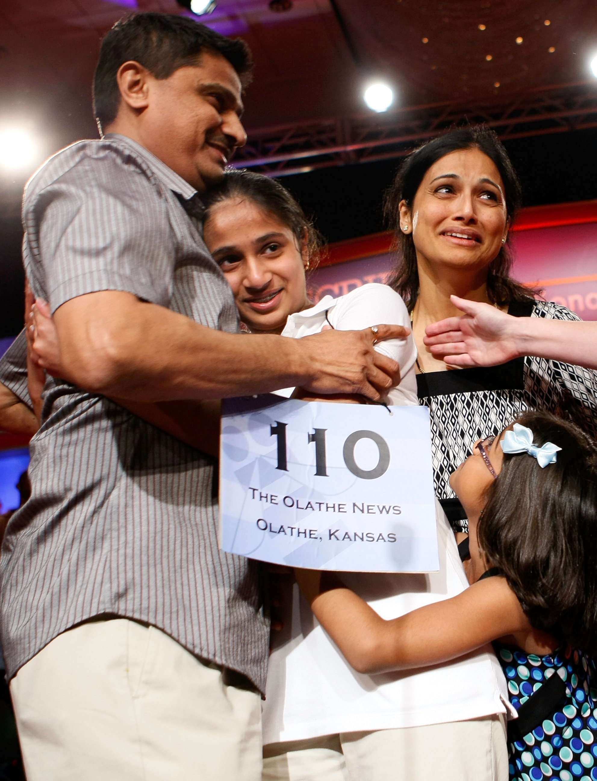PHOTO: Kavya Shivashankar of Olathe, Kansas, receives a hug from her parents Mirle and Sandy after she won the 2009 Scripps National Spelling Bee competition May 28, 2009 in Washington, DC. 