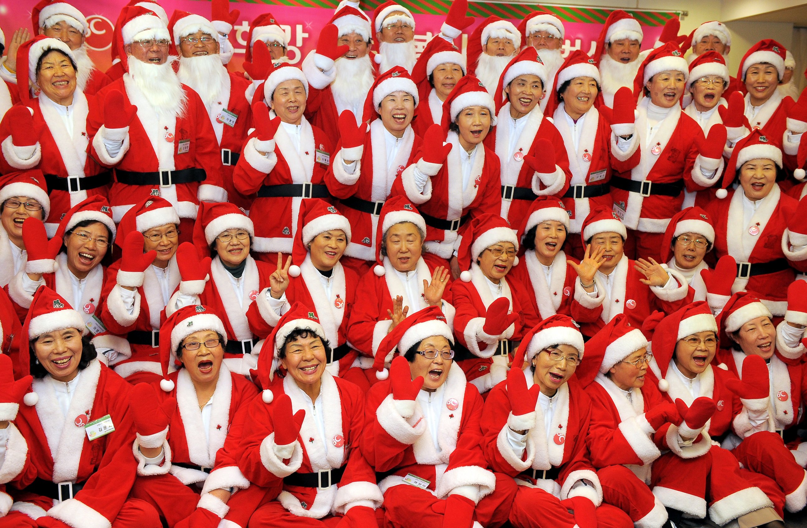 PHOTO: South Korean senior volunteers, clad in Santa Clause costumes, pose for a picture during a chairty event on December 15, 2009.