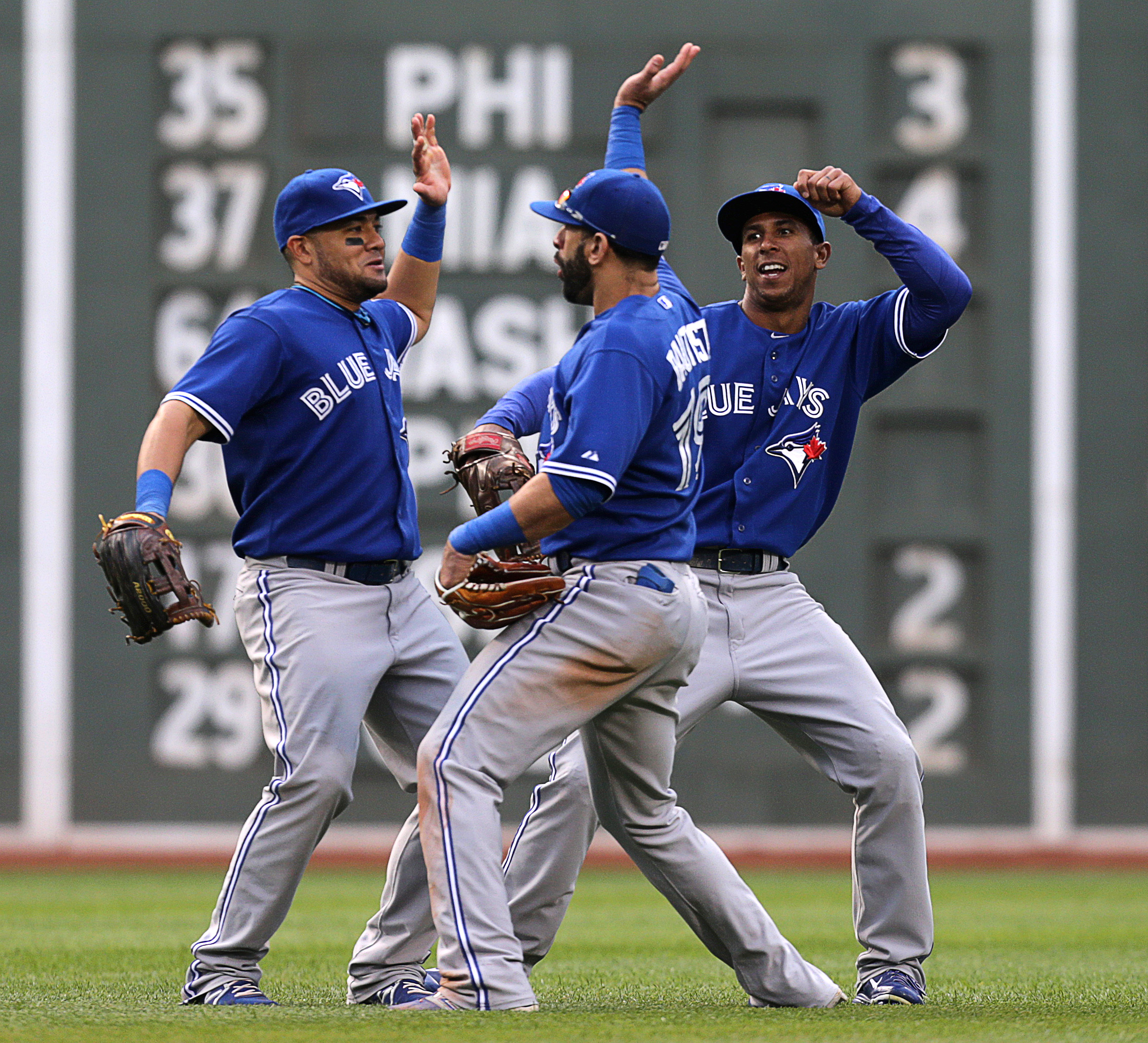 PHOTO:Melky Cabrera, Toronto, Jose Bautista, and Anthony Gose of the Toronto Blue Jays celebrate the 7-2 win with a dance in the outfield.