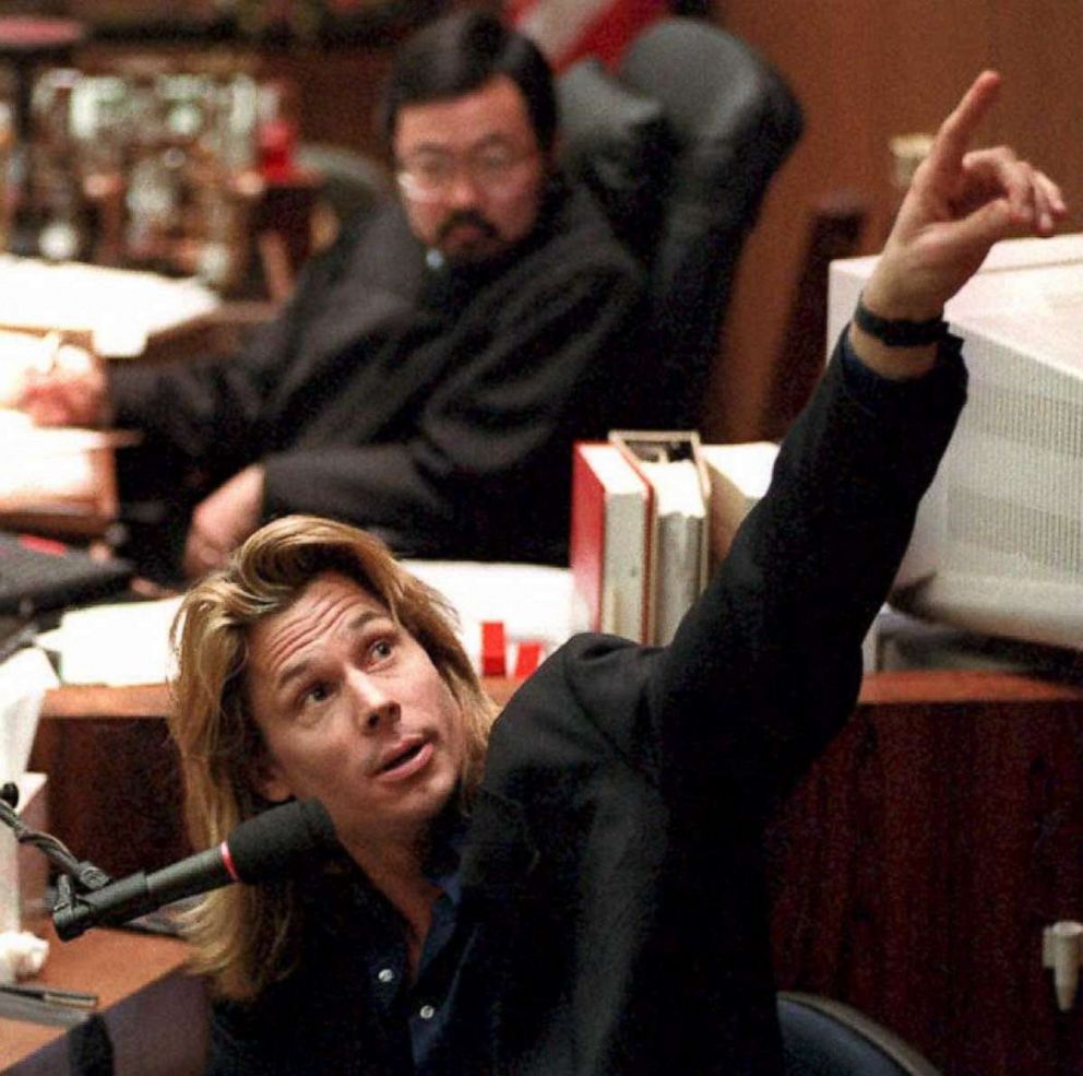 PHOTO: Judge Lance Ito watches as Brian "Kato" Kaelin points to a video screen showing the path behind his bedroom where the bloody glove was found by police detective Mark Fuhrman during his testimony on March 22, 1995.