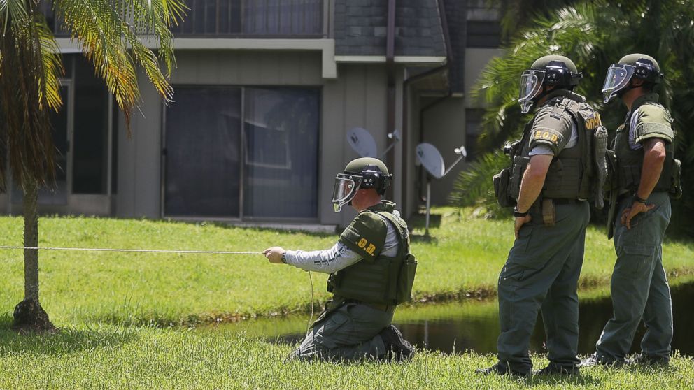 A Bomb Disposal Unit checks for explosives around the apartment building where shooting suspect Omar Mateen is believed to have lived on June 12, 2016 in Fort Pierce, Fla.