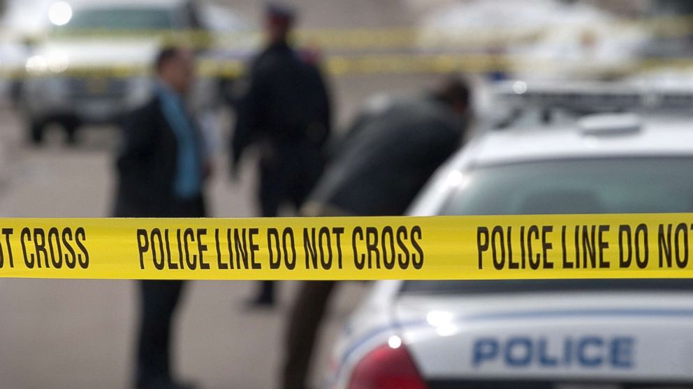 Police investigate a crime scene in this stock photo.
